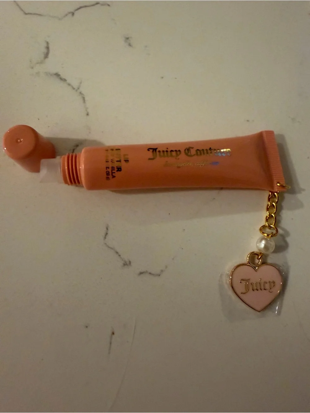 Juicy Couture Peach-Pink Lip Gloss Tube with Gold Heart Charm